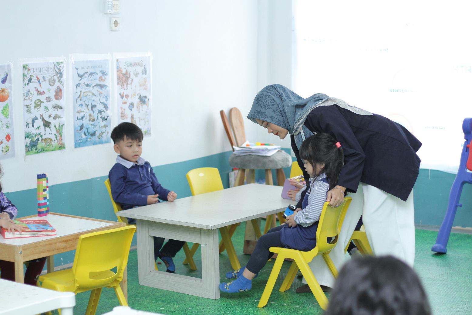 Kiddy classroom with desks and learning materials